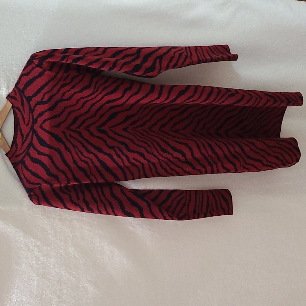 Brand new w/ tags. Women's long-sleeved sweater dress. Red animal print. Medium.